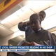 Royal Touch Barbershop owner Reggie Ross gives a haircut to a young customer while he reads.
WPTV Screenshot